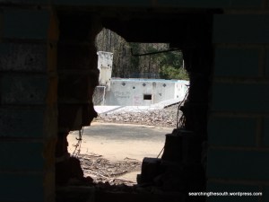 Hole in the showeroom wall. Nice view of the pool.