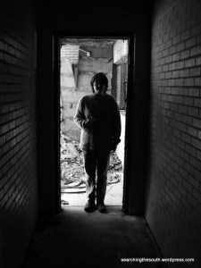 Mags in doorway at back of poolhouse.